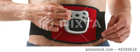 Athletic folded man uses an electric Athletic folded man uses an electric 48309018