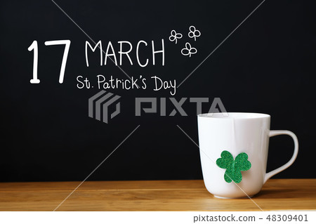 Saint Patricks Day message with a white mug Saint Patricks Day message with a white mug 48309401