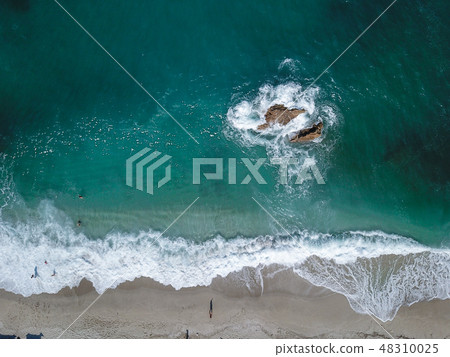 Aerial View From Flying Drone Of People Relaxing Aerial View From Flying Drone Of People Relaxing 48310025