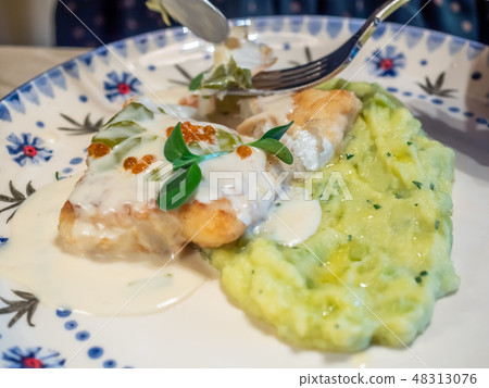 Grilled salmon fish with meshed potato Grilled salmon fish with meshed potato 48313076