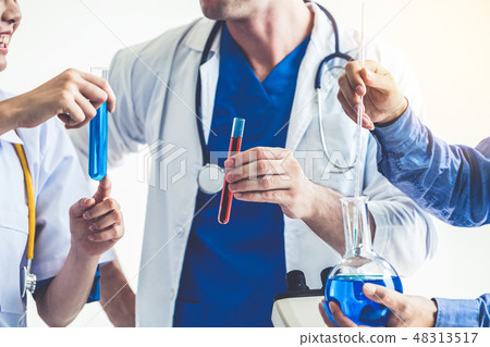 Group of scientists working in chemical lab. 48313517
