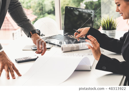 Architect and engineer working with drawing. Architect and engineer working with drawing. 48313922