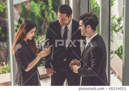 Three business people group talking in office. Three business people group talking in office. 48314013