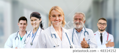 Doctor working in hospital with other doctors. Doctor working in hospital with other doctors. 48314152