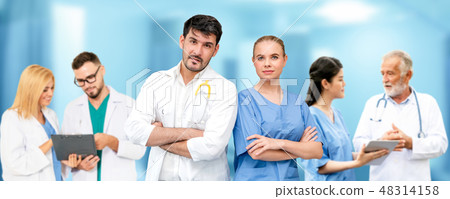 Doctor working in hospital with other doctors. 48314158