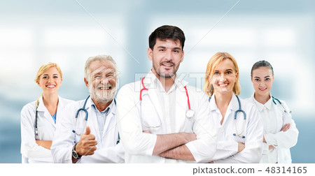 Doctor working in hospital with other doctors. 48314165