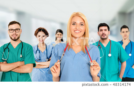 Doctor working in hospital with other doctors. 48314174