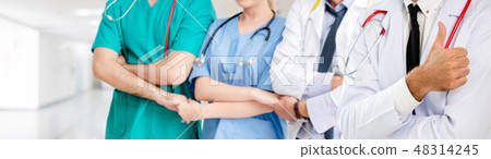 Doctor working in hospital with other doctors. Doctor working in hospital with other doctors. 48314245