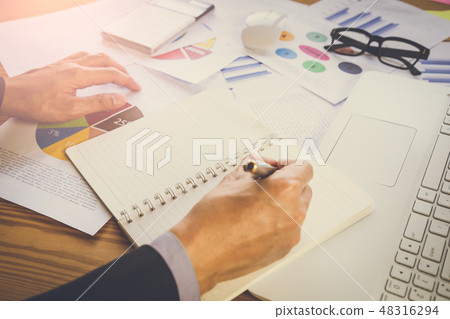 Businessman or accountant working on calculator to Businessman or accountant working on calculator to 48316294