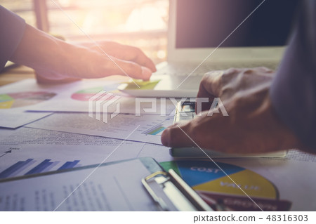 Businessman or accountant working on calculator to Businessman or accountant working on calculator to 48316303