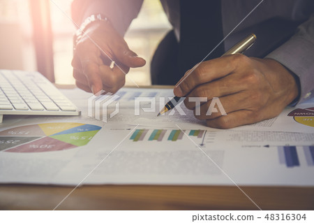 Businessman or accountant working on calculator to Businessman or accountant working on calculator to 48316304