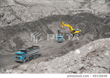 Large quarry dump truck. Loading the rock in dumper. Loading coal into body truck. Production useful 48316646