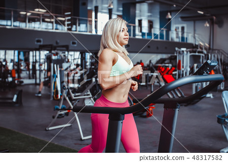 woman on the treadmill woman on the treadmill 48317582