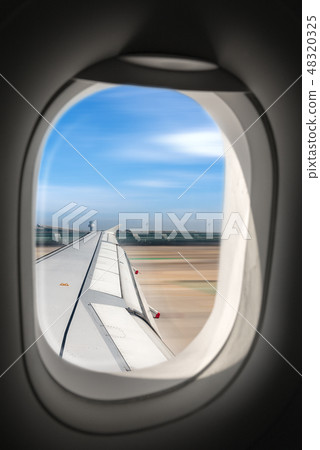 Airplane running on the airport runway Airplane running on the airport runway 48320325