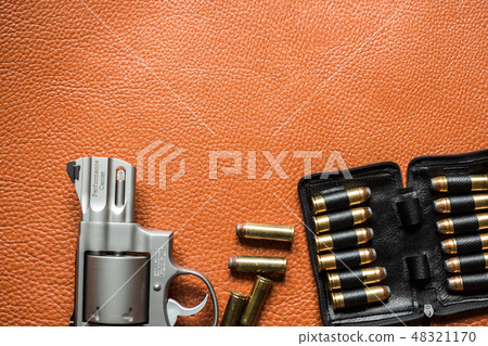 Revolver handgun with ammunition bullet 48321170