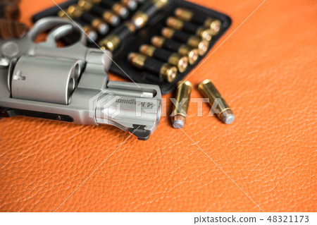 Revolver handgun with ammunition bullet 48321173