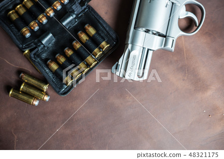 .44 magnum jacket soft point bullet on leather 48321175