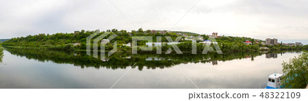 View of houses on the river bank View of houses on the river bank 48322109