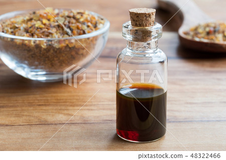 A bottle of myrrh essential oil with myrrh resin 48322466