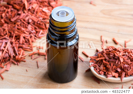 A bottle of sandalwood essential oil  48322477