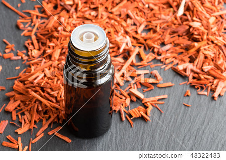 A bottle of sandalwood essential oil  48322483