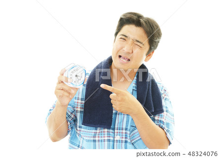 A man with a tired expression A man with a tired expression 48324076