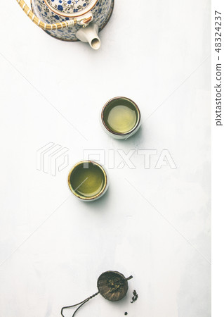 Tea composition on grey background, flat lay Tea composition on grey background, flat lay 48324237