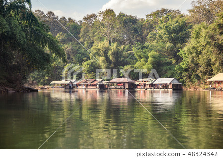 Wooden raft building on river kwai in tropical 48324342