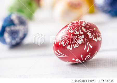 Close-up multicolored easter eggs on wooden table Close-up multicolored easter eggs on wooden table 48325850