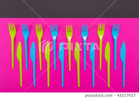 Many color plastic cutlers on a bright background 48327637