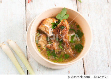 Chicken soup in bowl. 48329478