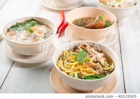 Noodles and soup. 48329505