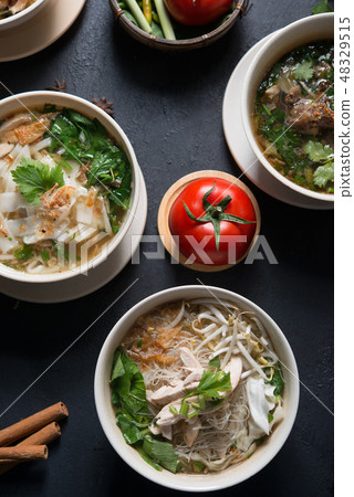 Noodles and soup. 48329515