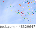 A balloon flying in the sky 48329647
