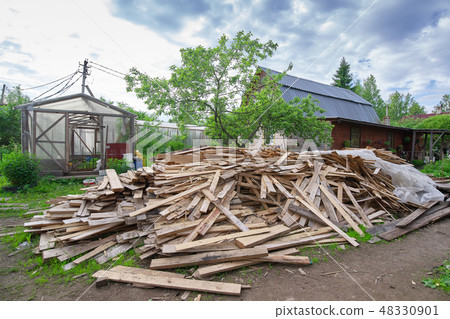 Pile of planks after renovation of building Pile of planks after renovation of building 48330901