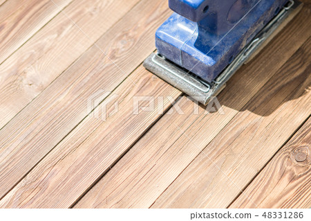 Wooden floor and blue grinder 48331286
