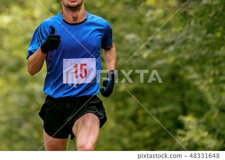 athlete runner in blue t-shirt athlete runner in blue t-shirt 48331648