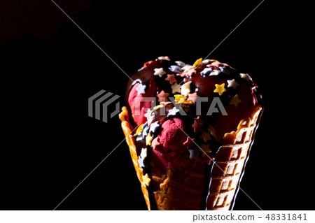 Ice cream with chocolate topping in waffle cone 48331841