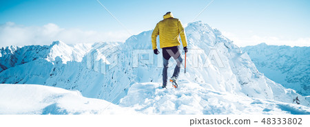 A climber in winter A climber in winter 48333802