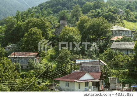 View of the mountains  with forest and the chapel 48333882