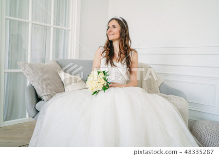 Beautiful smiling woman bride in wedding dress  48335287