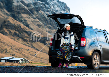 Female traveler enjoying Iceland view from the car 48337455