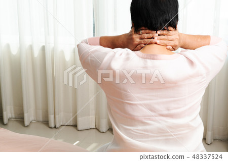 neck and shoulder pain, old woman suffering 48337524