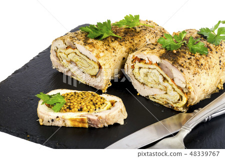 Chicken meat rolls with egg pancakes and carrots.  48339767