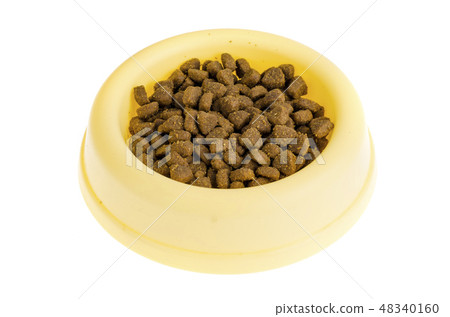 Yellow plastic bowl with dry pet food Yellow plastic bowl with dry pet food 48340160