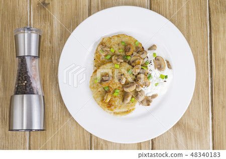 Rustic food concept. Fried potato pancakes  48340183