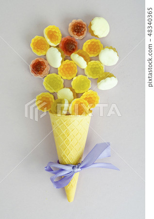 Creative photo of waffle cone with jelly candies Creative photo of waffle cone with jelly candies 48340365