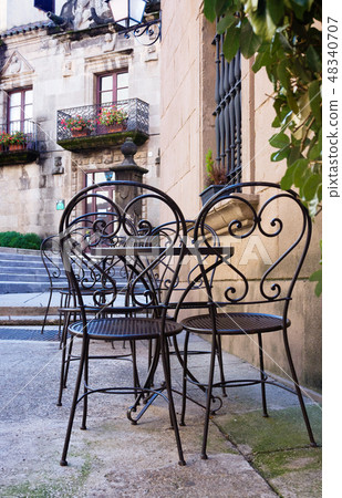 Street cafe with metal chairs in Barcelona, Spain Street cafe with metal chairs in Barcelona, Spain 48340707