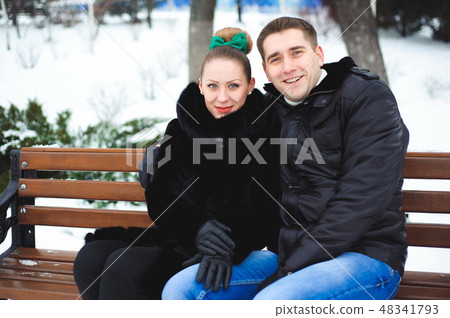 Couple in love in the winter park. 48341793
