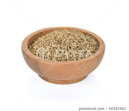 Caraway seeds in wooden bowl on white background 48342862